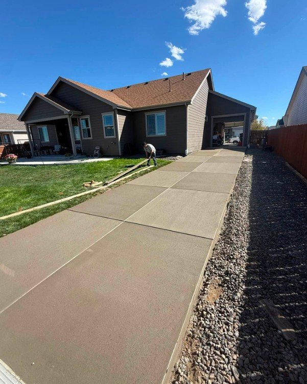 Concrete crew completing finishing work on-site in Plattsburgh, New York
