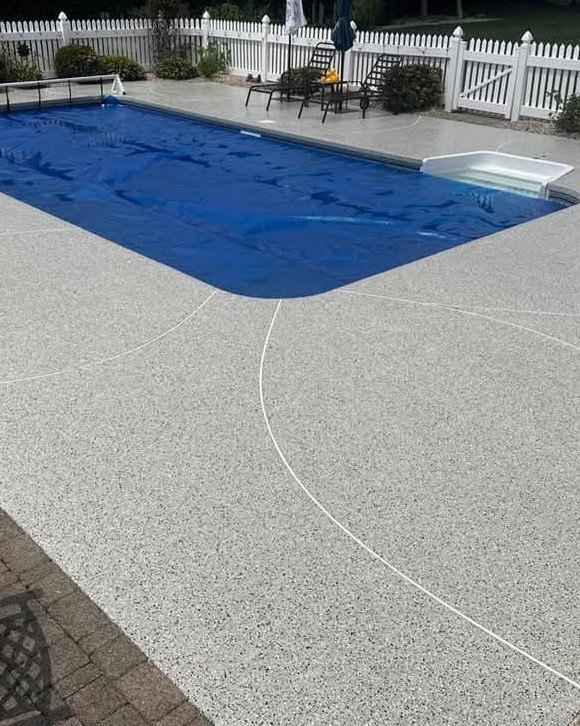 Residential concrete pool deck with a non-slip finish in Plattsburgh, New York