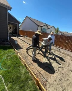 Skilled concrete workers pouring a fresh slab in Plattsburgh, New York